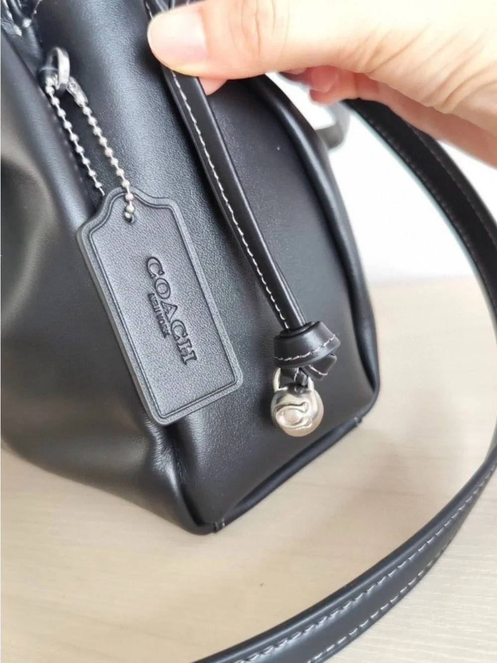 Coach sleek black